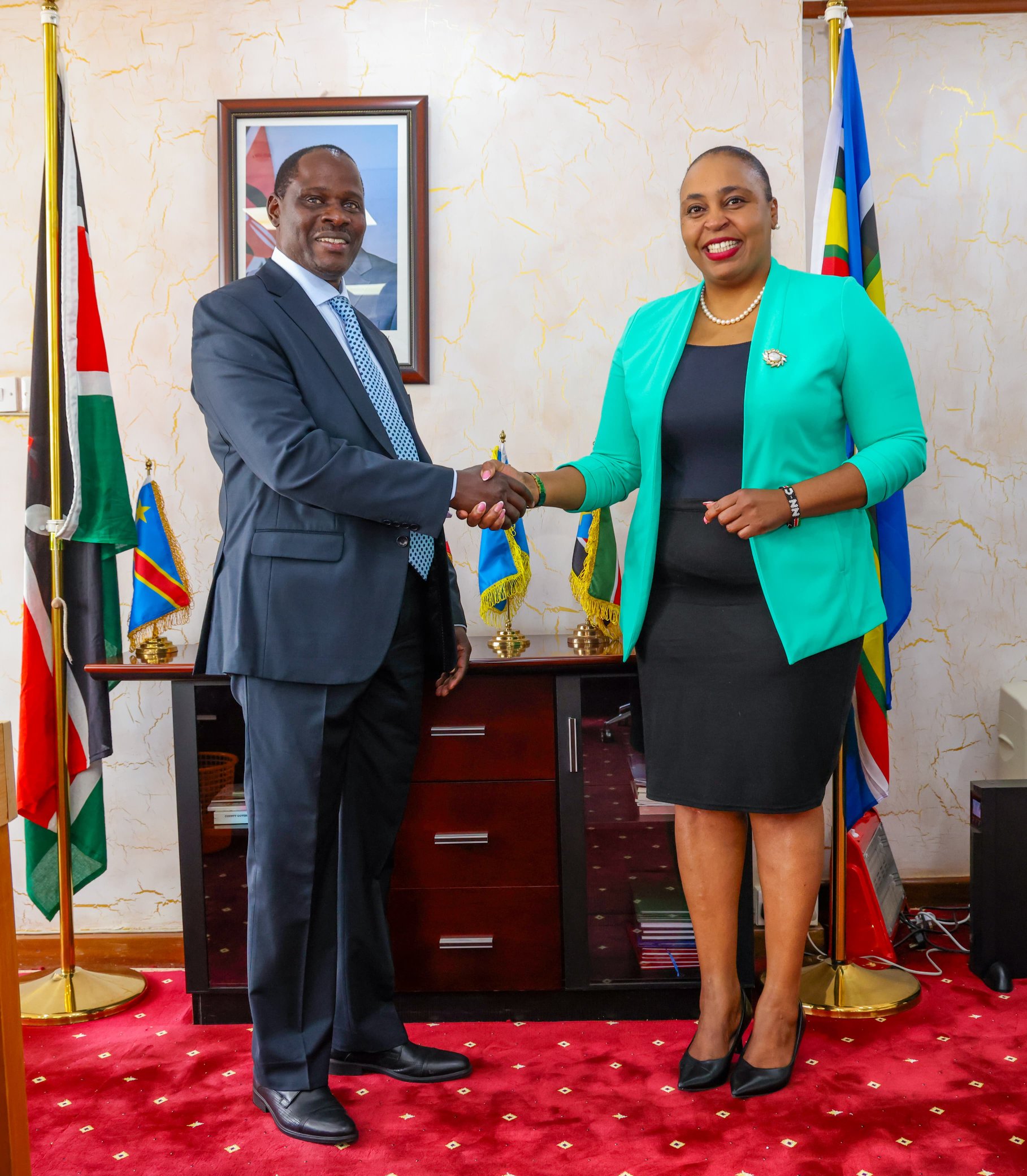 PS Wagunda and PS Karugu shake hands